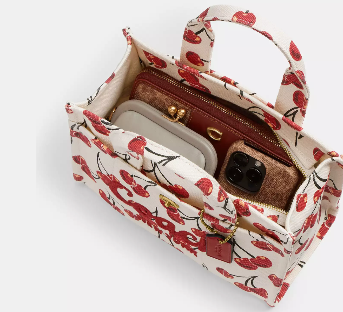 Bolso pequeño en tela grabado cereza marca coach