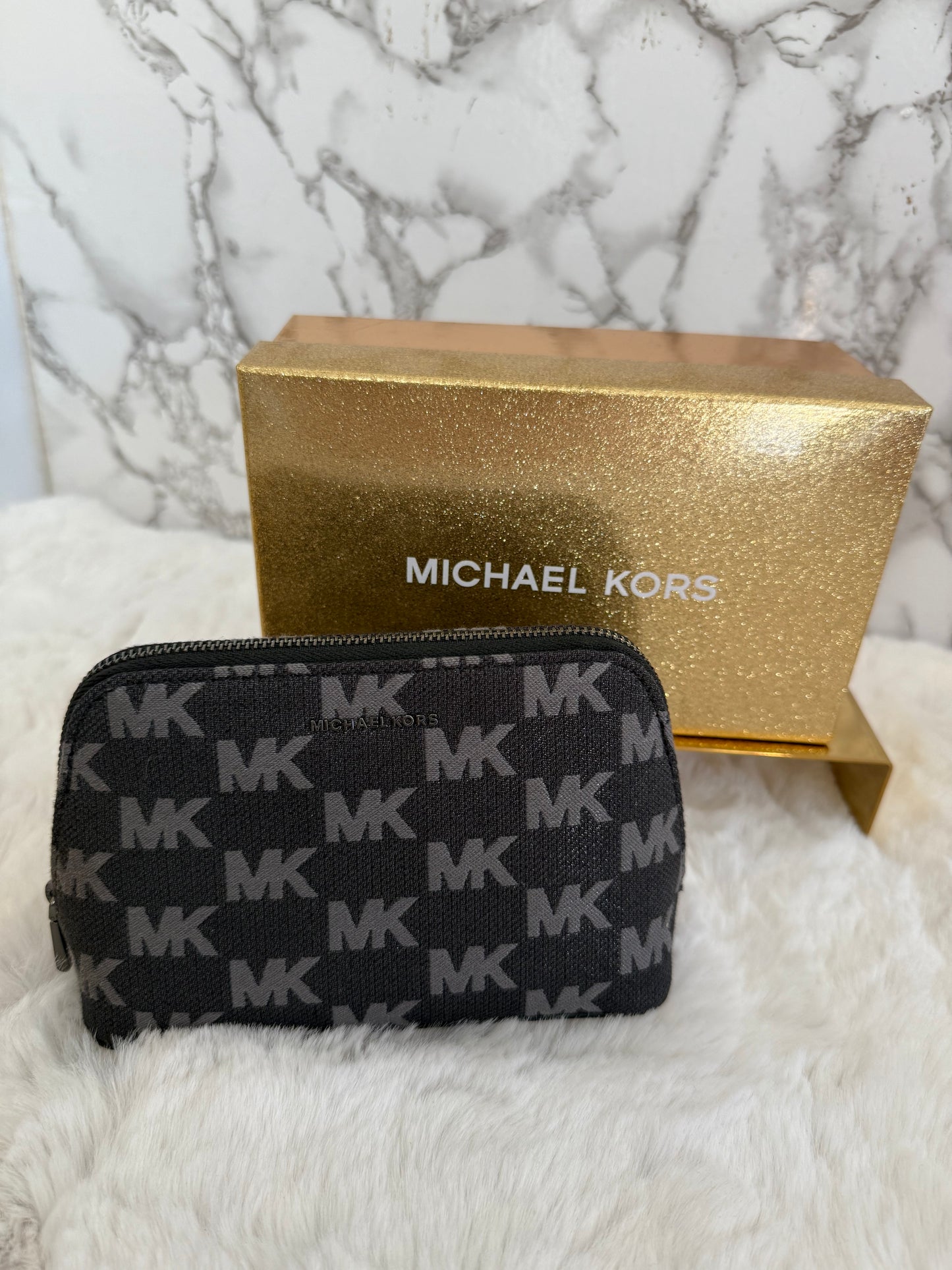 Cosmetiquera marca Michael Kors