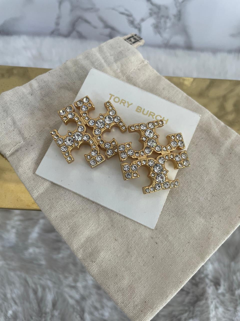 Aretes marca Tory Burch piedra dorados grandes