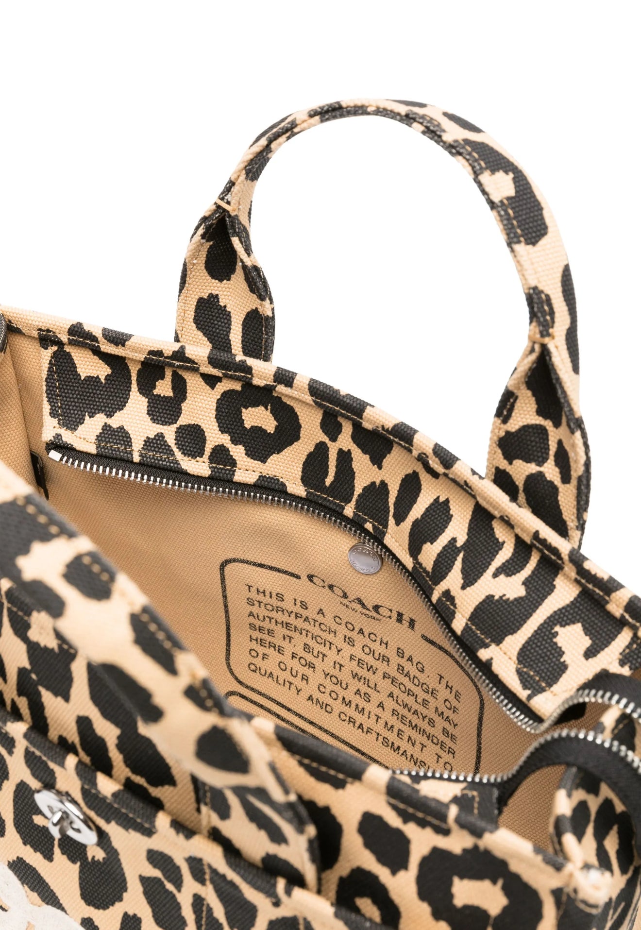 Bolsa tote en tela mediana marca Coach atigrado