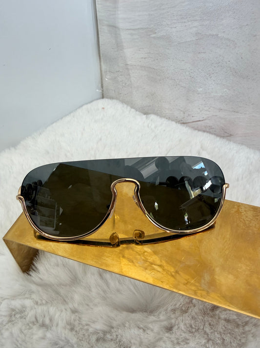 Lentes armazón dorado marca Versace unisex
