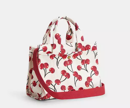Bolso pequeño en tela grabado cereza marca coach