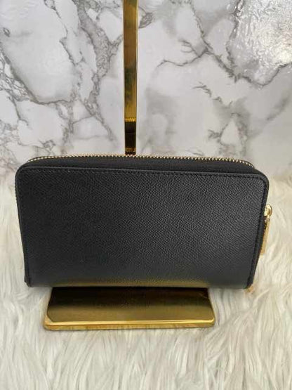 Cartera negra marca Michael Kors