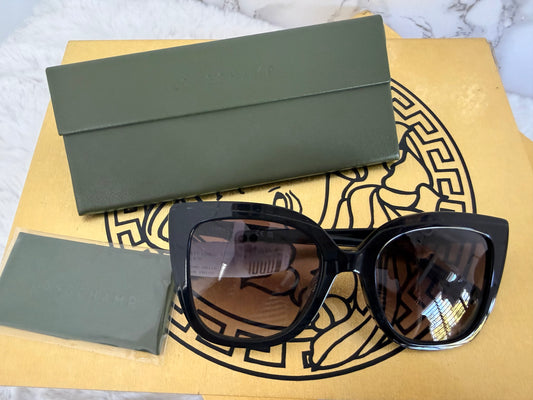 Lentes de dama negros marca Longchamp con estuche