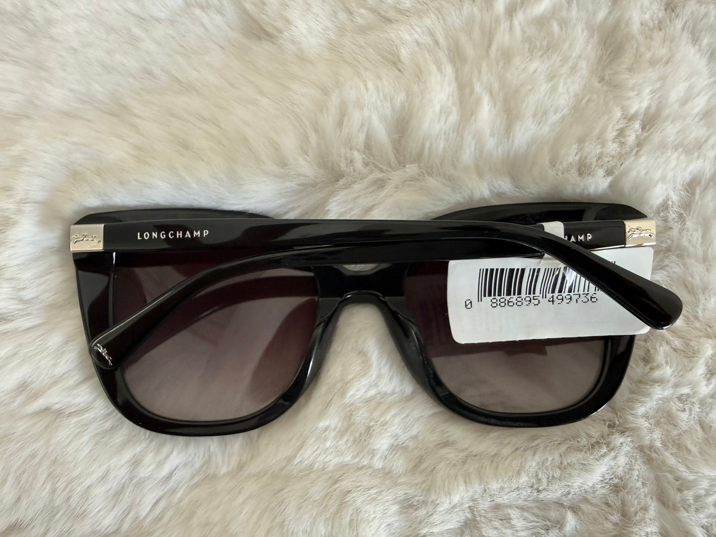 Lentes de dama negros marca Longchamp con estuche