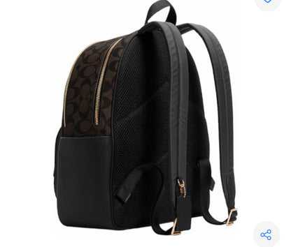 Mochila tipo piel marca Coach monogram