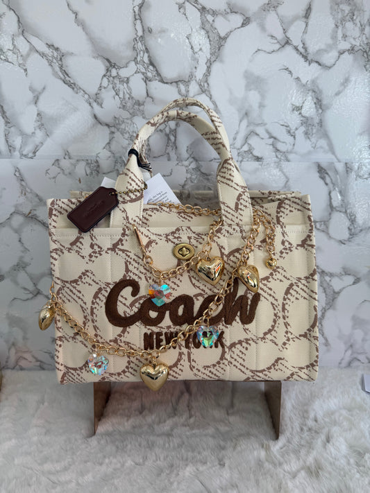 Bolsa tipo CROSSBODY nude en tela marca Coach tamaño mediana