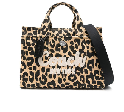 Bolsa tote en tela mediana marca Coach atigrado
