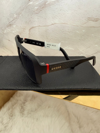 Lentes unisex marca Guess con estuche de bolsa