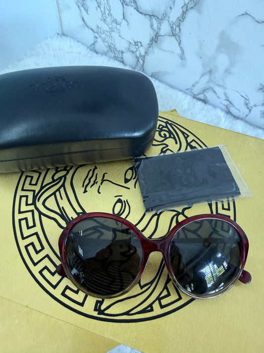 Lentes redondo grande de dama armazon color tinto marca Coach con estuche